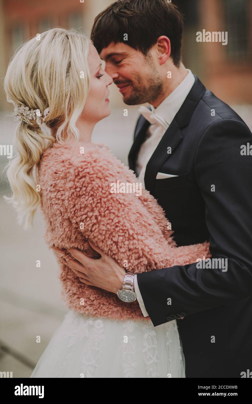 Newlyweds kiss tenderly in hi-res stock photography and images - Alamy