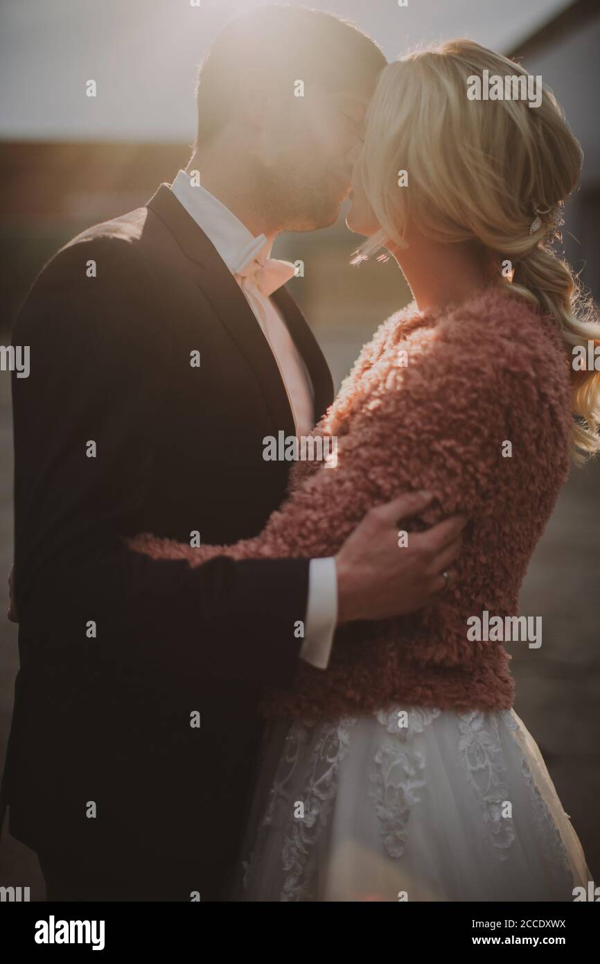 Newlyweds kiss tenderly in hi-res stock photography and images - Alamy