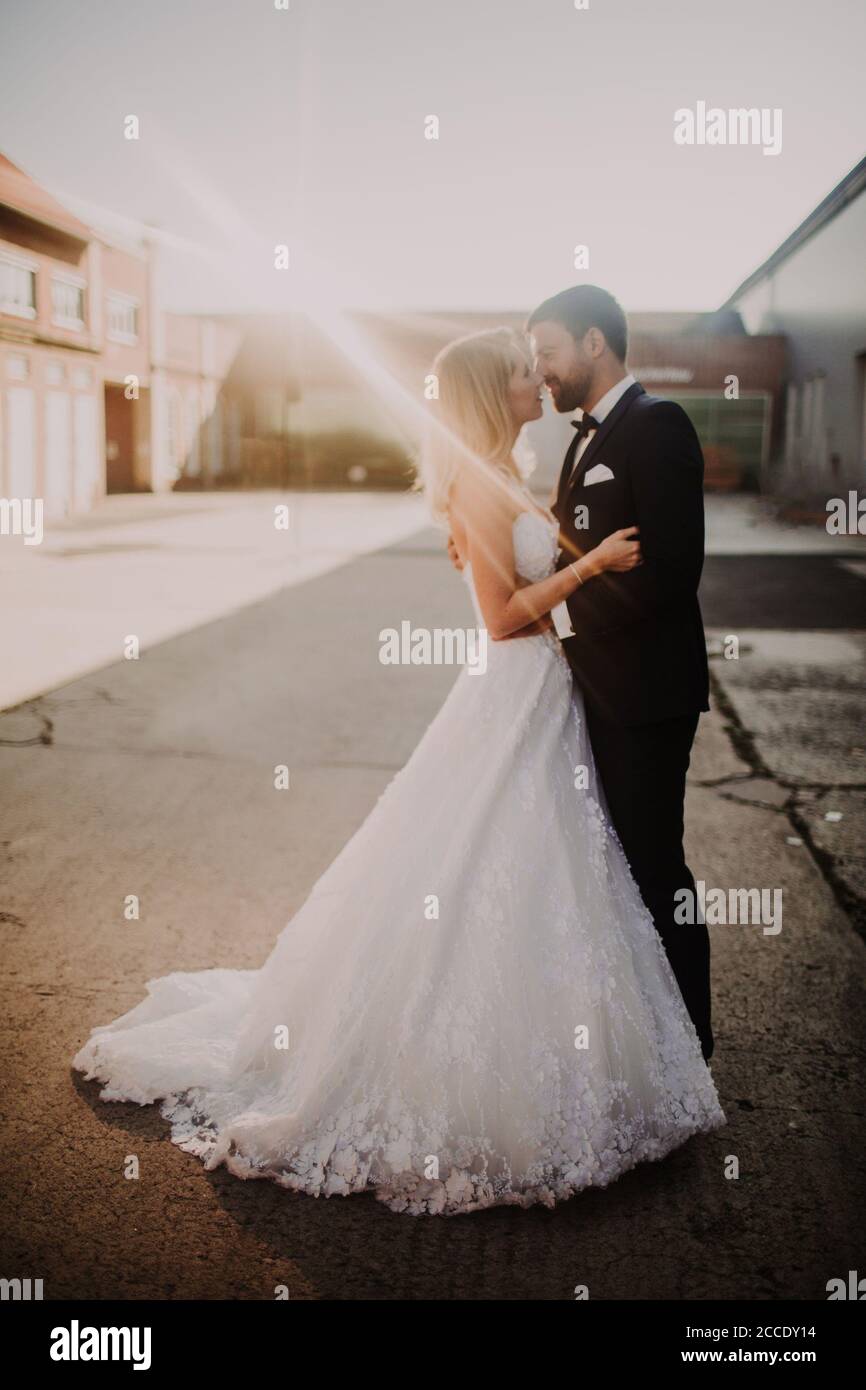 Newlyweds kiss tenderly in hi-res stock photography and images - Alamy