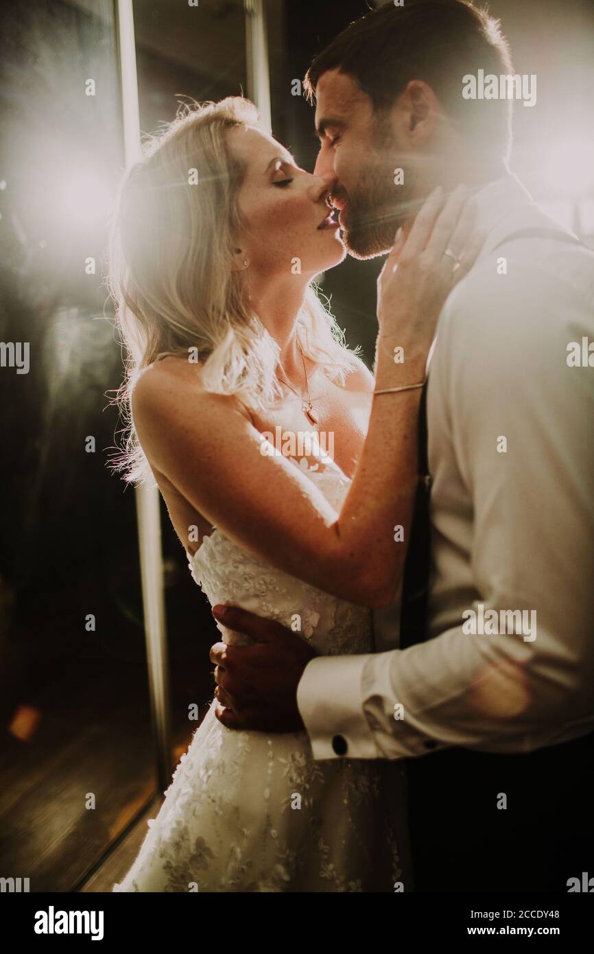 Newlyweds kiss tenderly in hi-res stock photography and images - Alamy