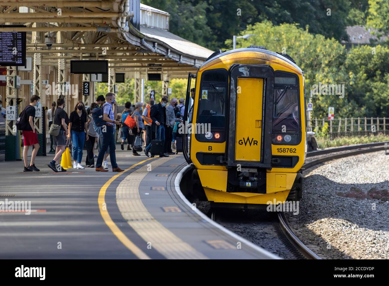 Passengers boarding the Great Western Railway train 158762 at Bath Spa