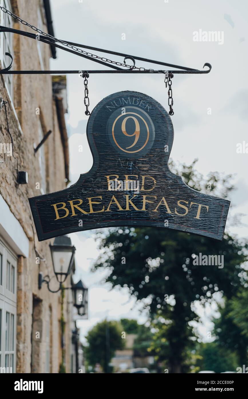 Stow-on-the-Wold, UK - July 10, 2020: Hanging sign outside Number Nine Bed & Breakfast in Stow-on-the-Wold, a market town in Cotswolds, UK, built on R Stock Photo