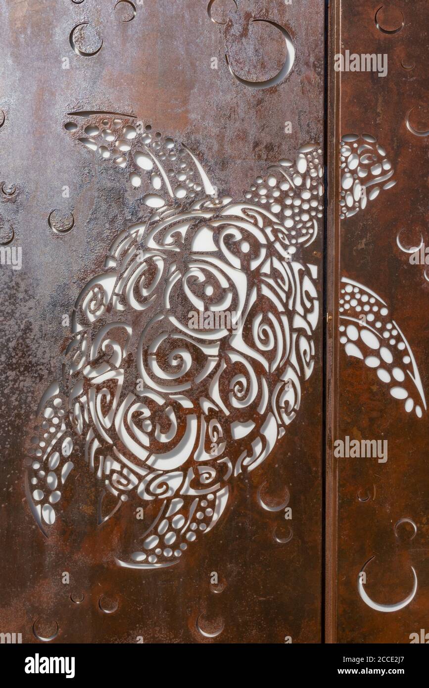 an image of a turtle engraved on some doors at the airport or terminal in zante zakynthos, greece. Stock Photo