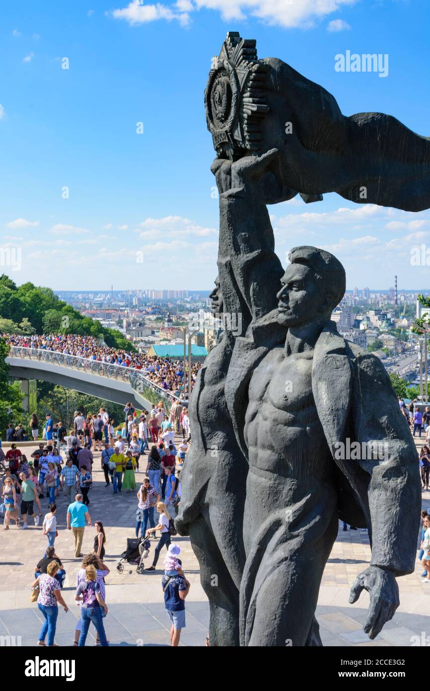 Kiev (Kyiv), People's Friendship Arch (Friendship of Nations Monument), glass floor Klitschko Pedestrian-Bicycle Bridge, bronze statue depicting a Rus Stock Photo