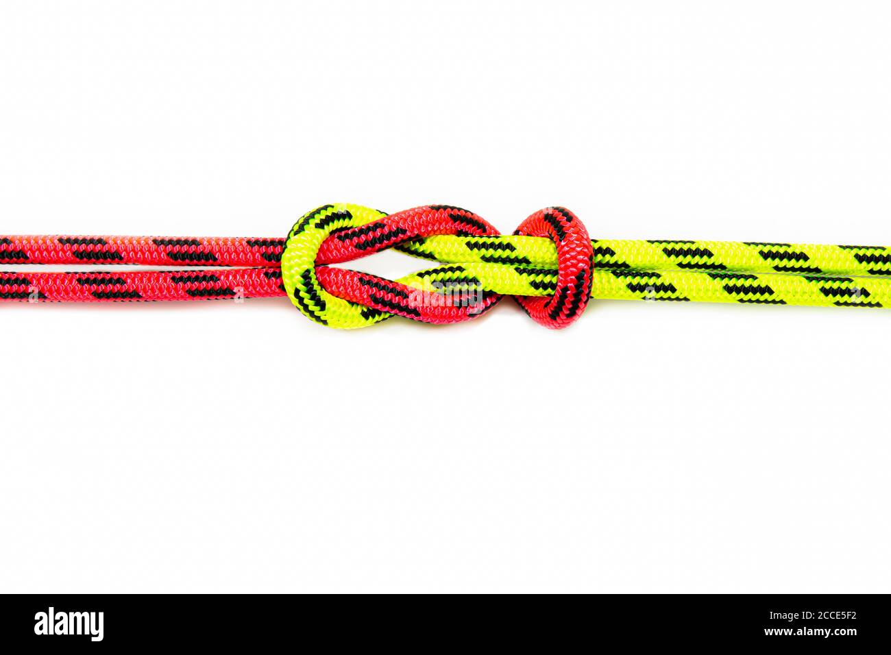 Reef, Hercules, square, double or brother hood Binding knot binding two colored red and green ropes. nautical loop used to secure rope or fishing line Stock Photo