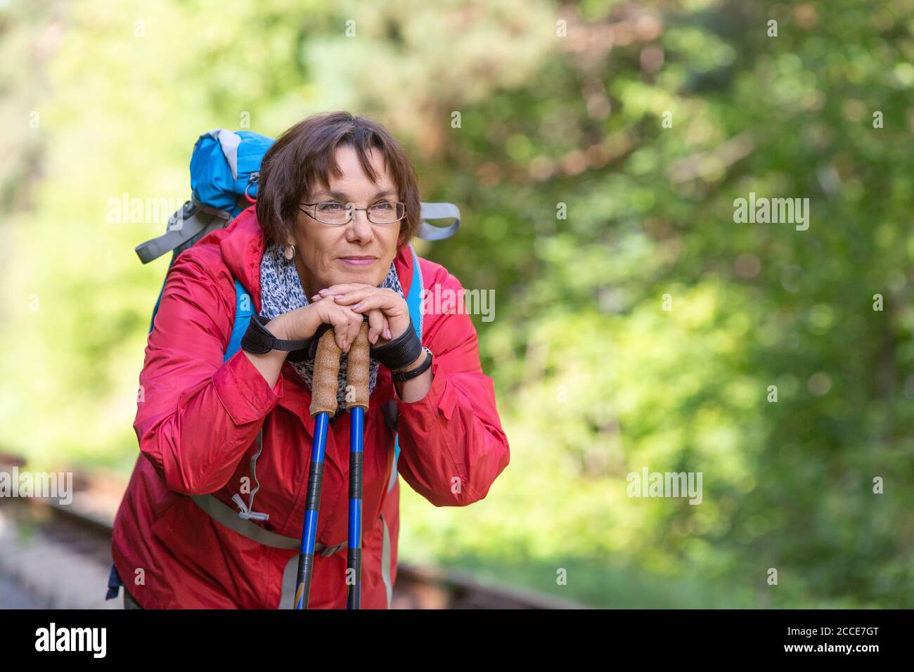 Portrait of a senior hikre woman havong rest after walking. Active lifestyle concept at the age after 60. Stock Photo