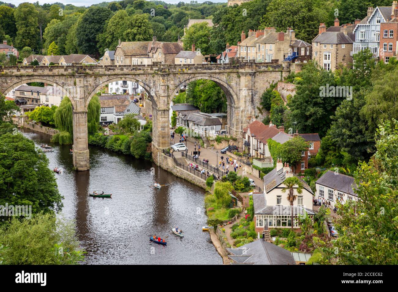 Boating under Knaresborough viaduct over the river Nidd, Yorkshire, England Stock Photo