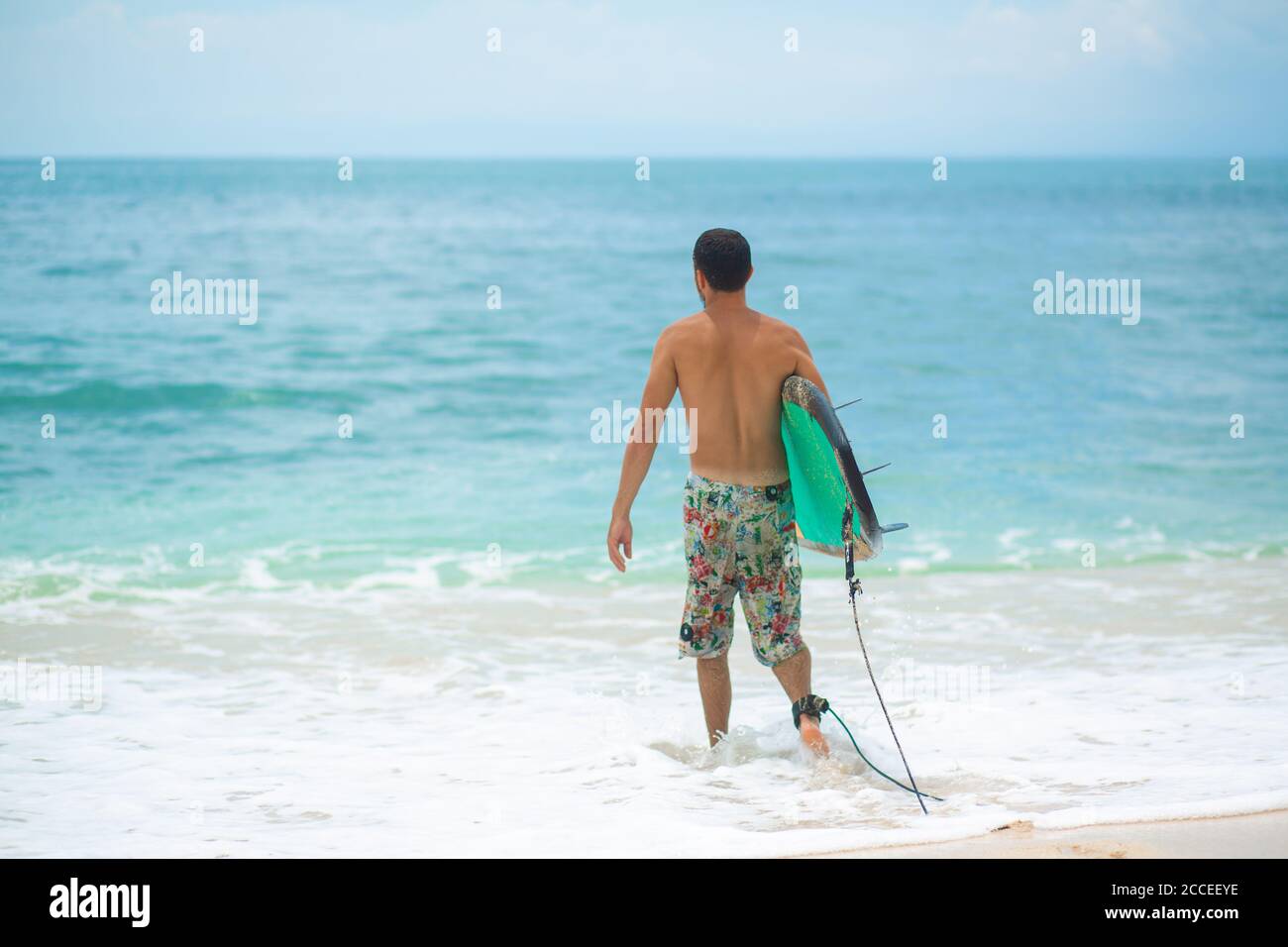 Surfer. Surfing Man With Surfboard Walking On Sandy tropical Beach ...