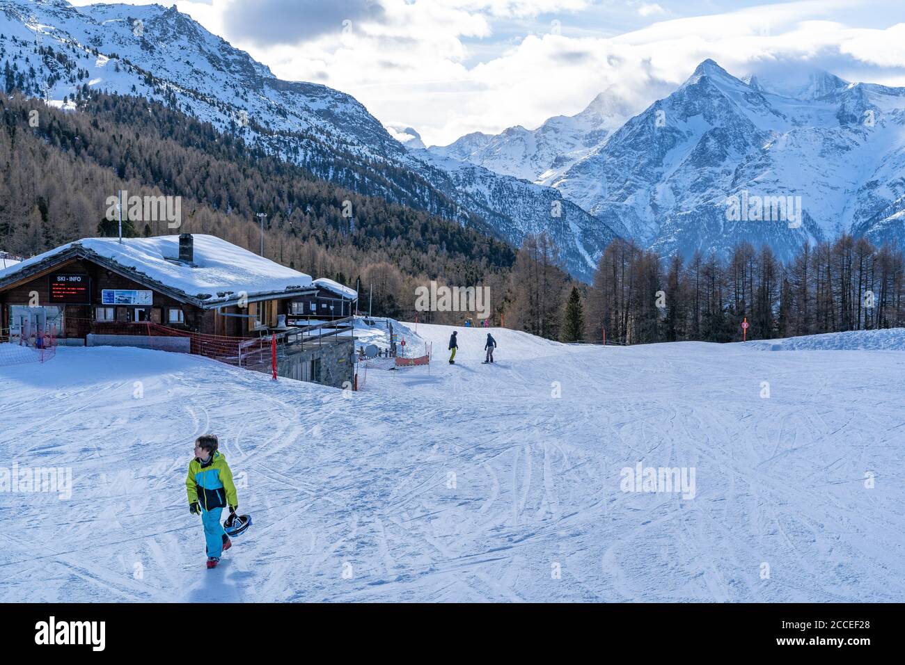 Europe, Switzerland, Valais, Grächen, Hannigalp, Junge walks through the Hannigalp ski area against the backdrop of the Valais Alps Stock Photo