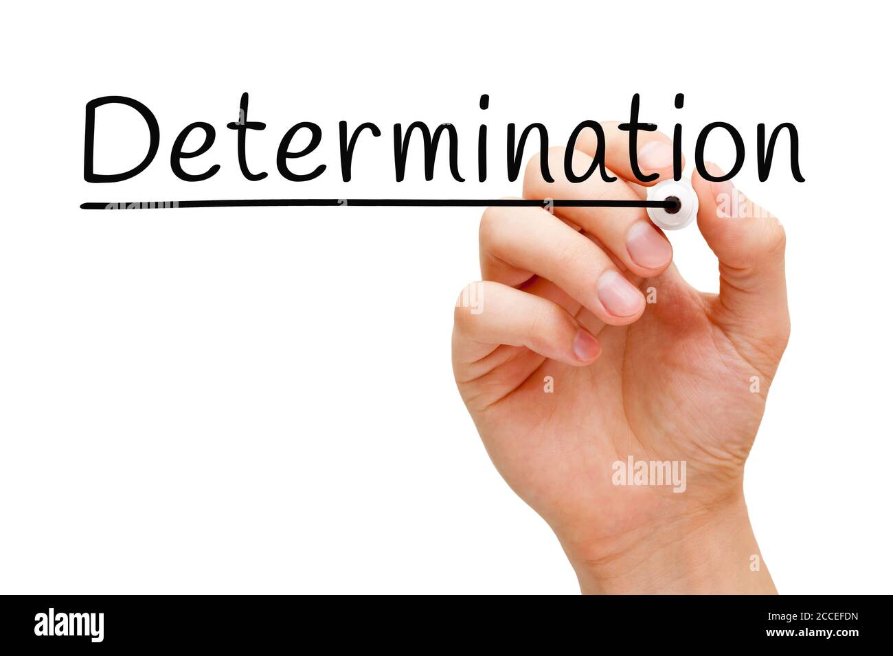 Hand writing the word Determination with black marker on transparent wipe board. Stock Photo