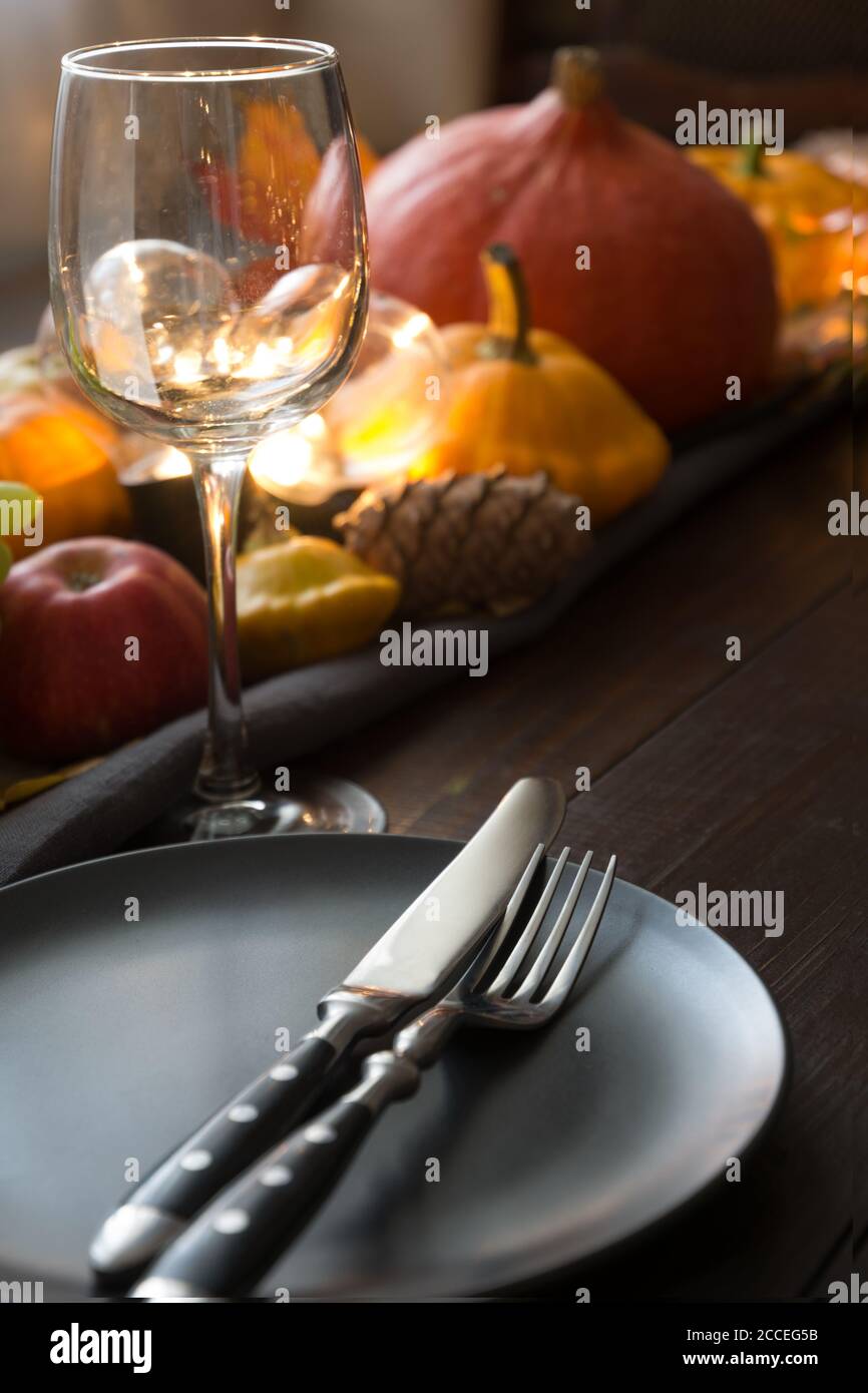Fall place setting with pumpkins, autumn harvest. Thanksgiving Day. Close up. Stock Photo