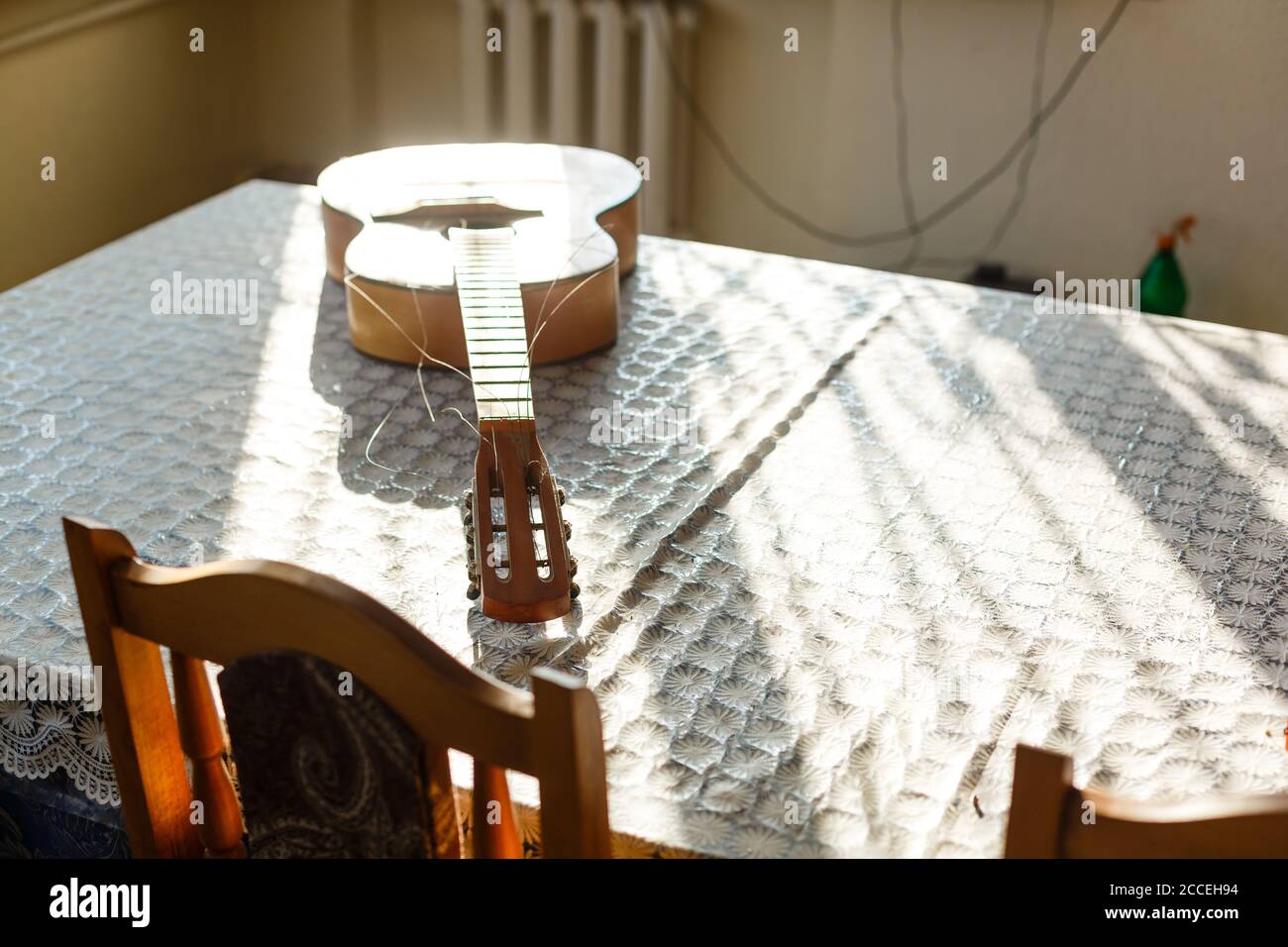 broken guitar with torn strings Stock Photo Alamy