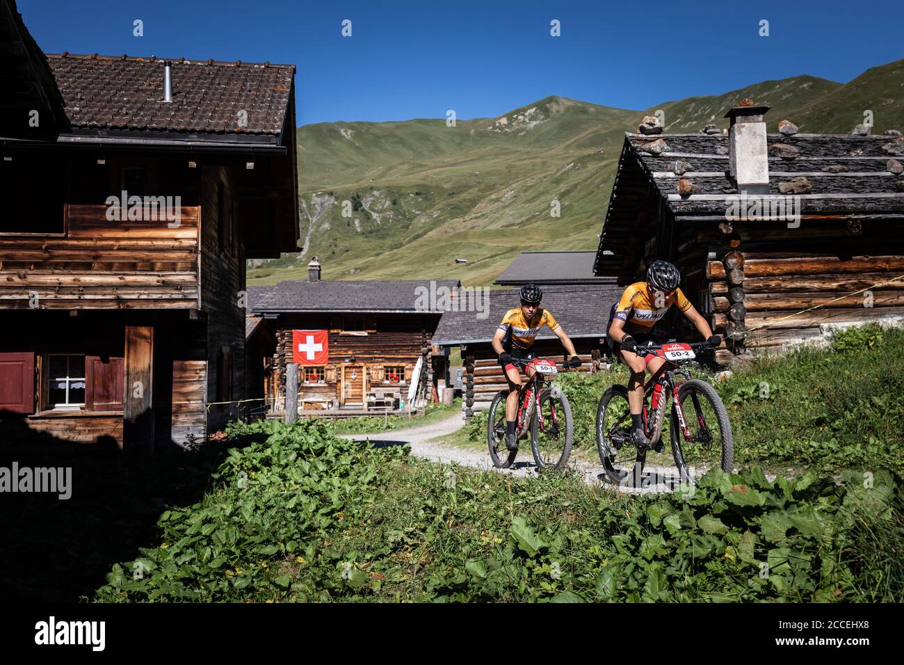 Annika Langvad and  Haley Batten (Denmark, USA) of two-person teams in action during the 4th day of Swiss Epic 5-day stage race in Davos, Switzerland, Stock Photo