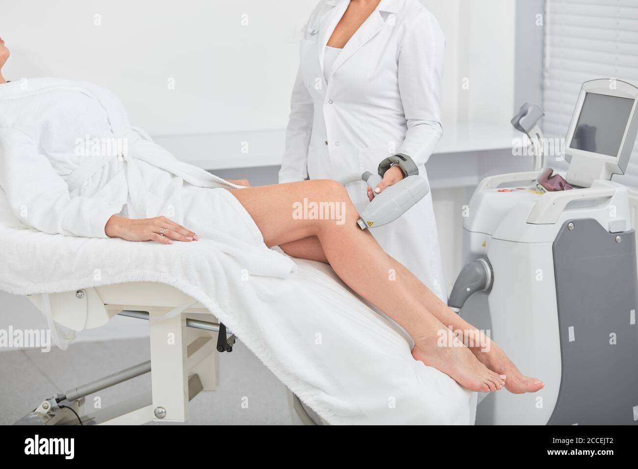 nurse using a laser hair removal at workplace, close up cropped photo, new  removal techniques Stock Photo - Alamy