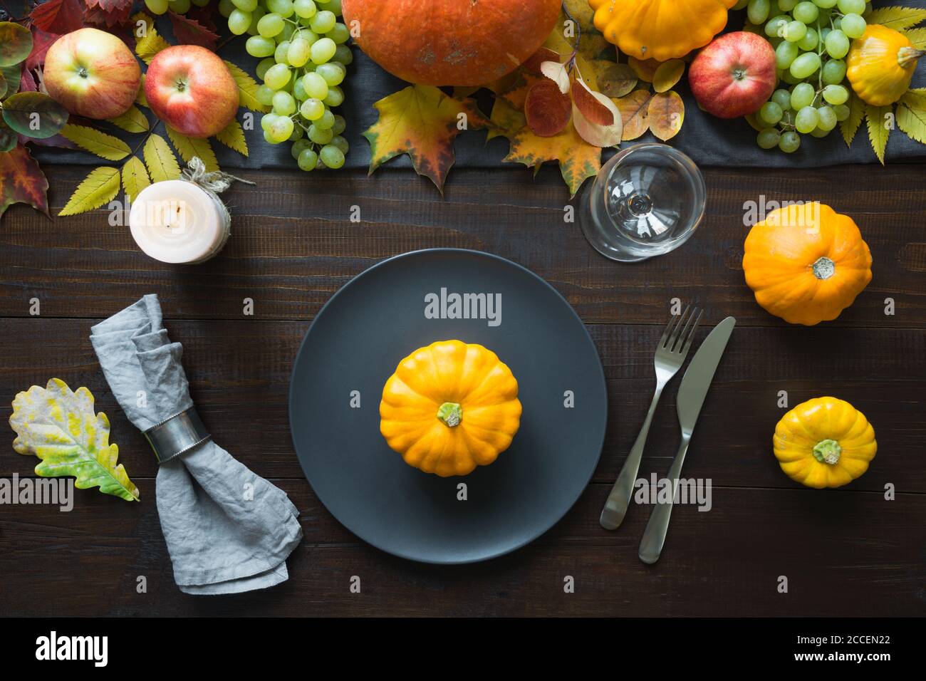 Fall table place setting decorated vegetables, pumpkins, aplles, harvest. Thanksgiving Day. Stock Photo