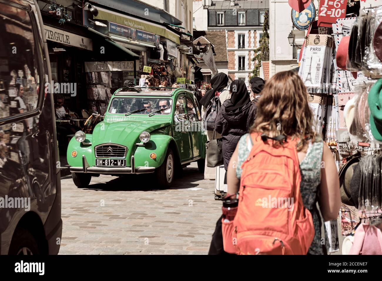 EuropEurope, France, Paris, Montmartre, Sacre Coeur, Old car driving tourists through streets of montmartre, Citroen 2cv, green car, Stock Photo