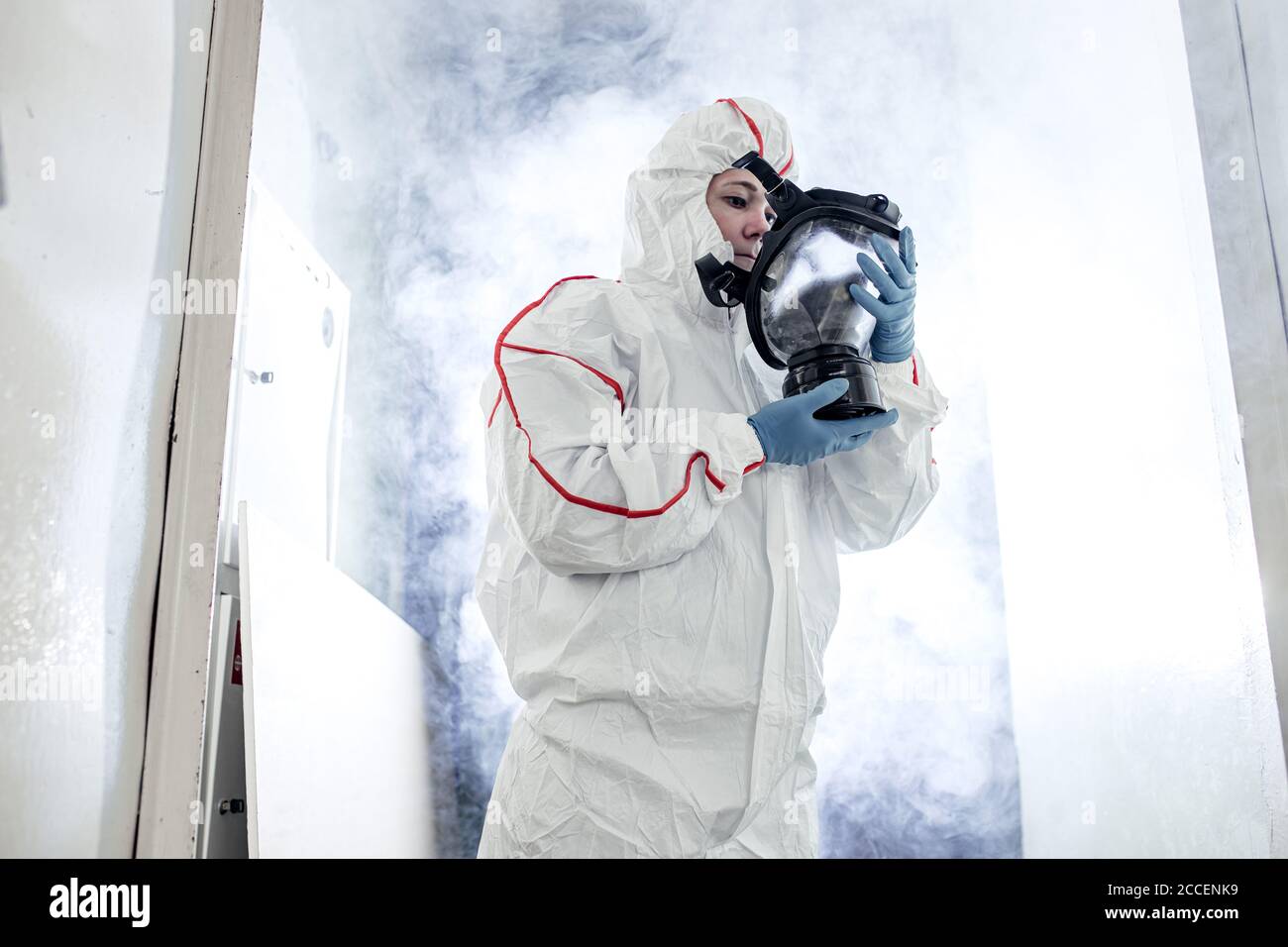 male in protective hazmat suit and gas-mask against coronavirus ...