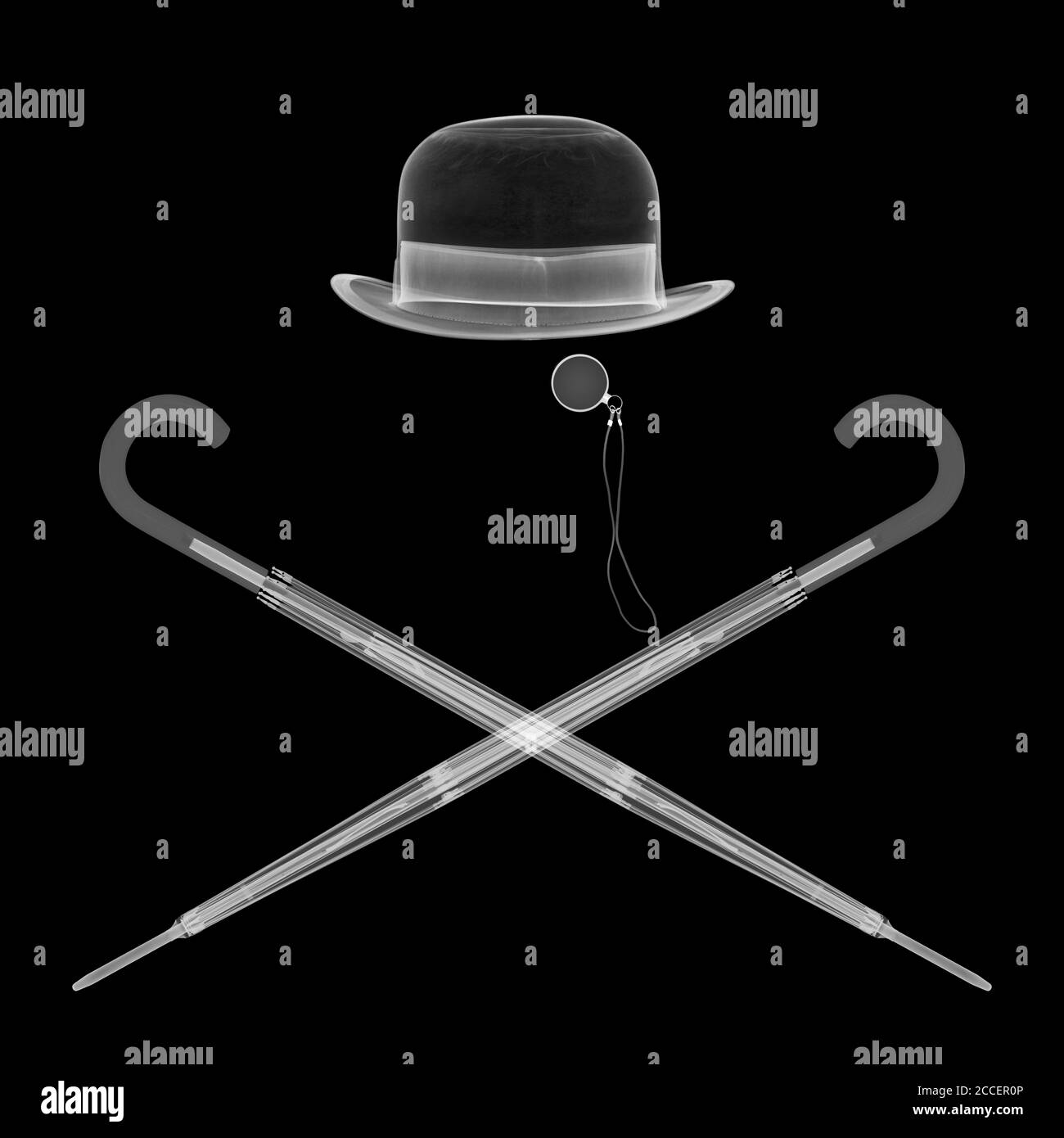 Bowler hat monocle and two umbrellas, X-ray Stock Photo