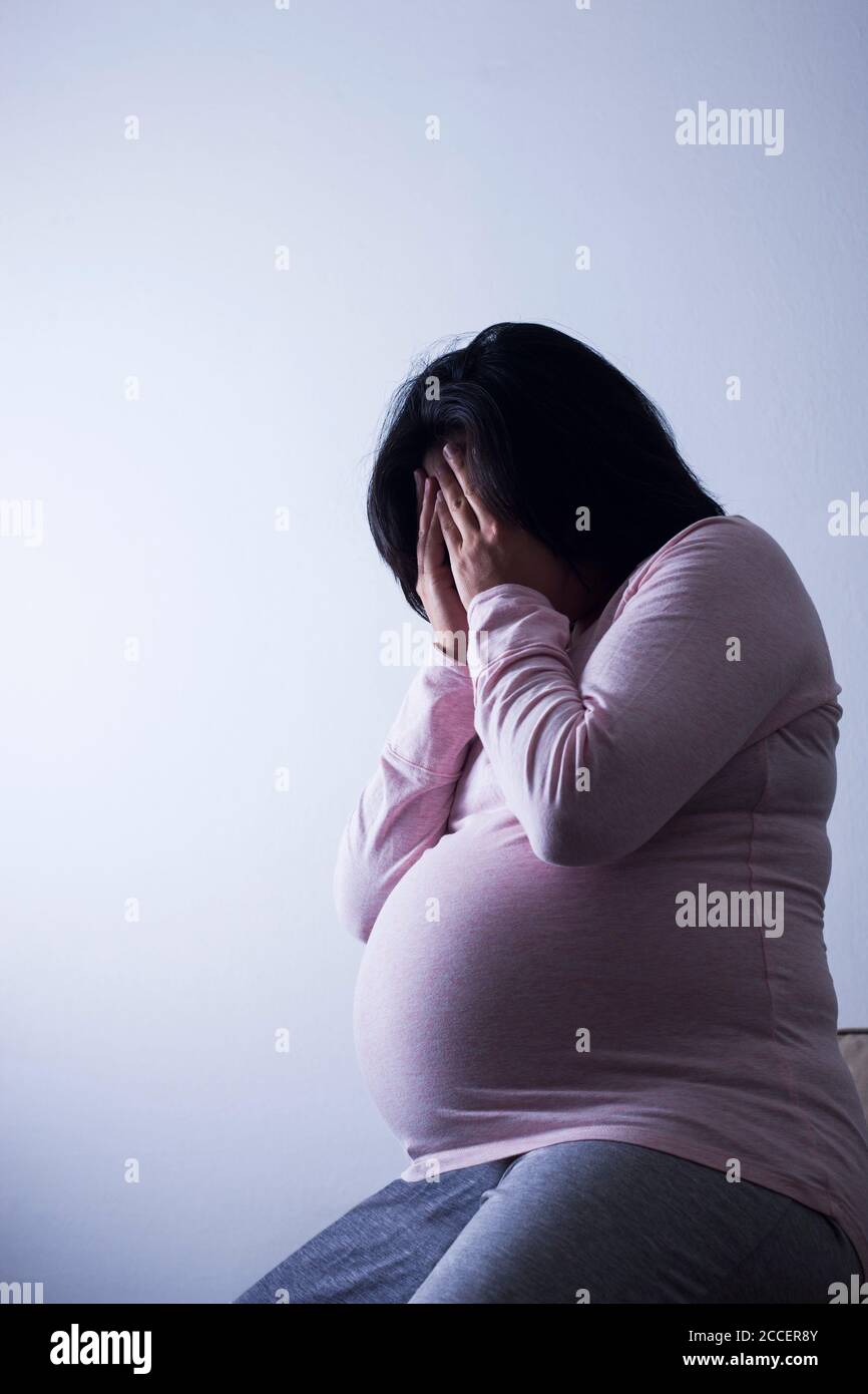 Depressed pregnant woman Stock Photo