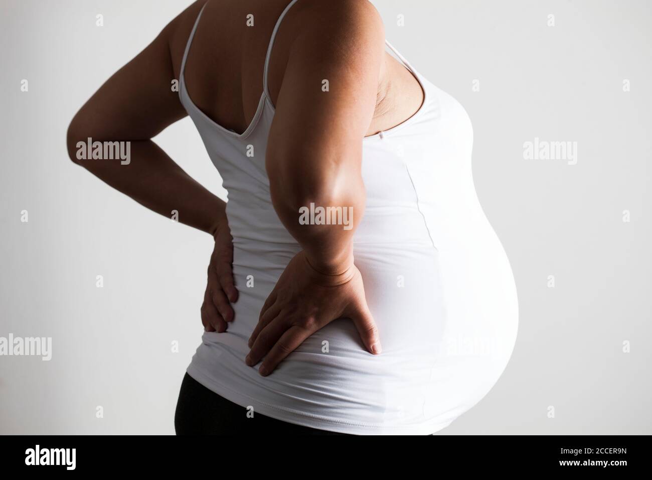 pregnant-woman-with-lower-back-pain-stock-photo-alamy