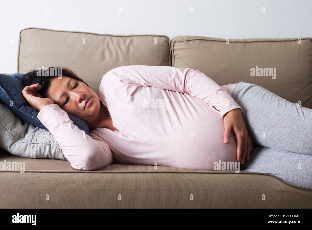 Tired pregnant woman Stock Photo