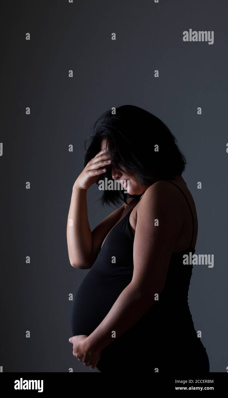 Worried pregnant woman Stock Photo