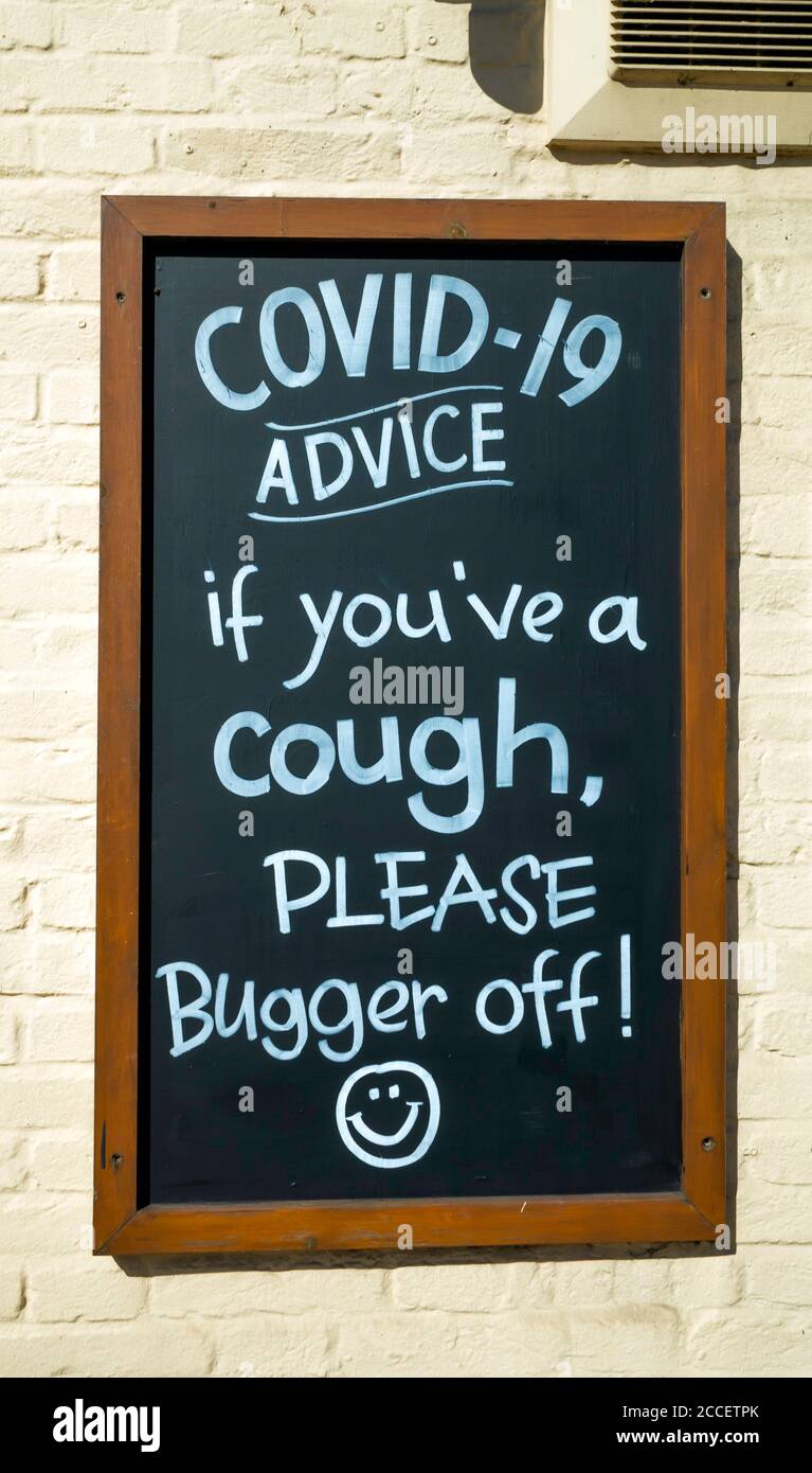 Sign on a blackboard outside a North Yorkshire Inn, Covid 19 Advice If you've a cough please bugger off Stock Photo