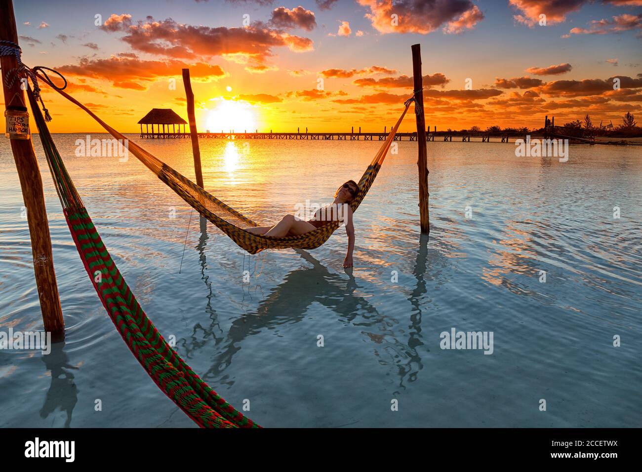 Woman in hammock, Holbox Island, Cancun, Yucatan, Mexico Stock Photo