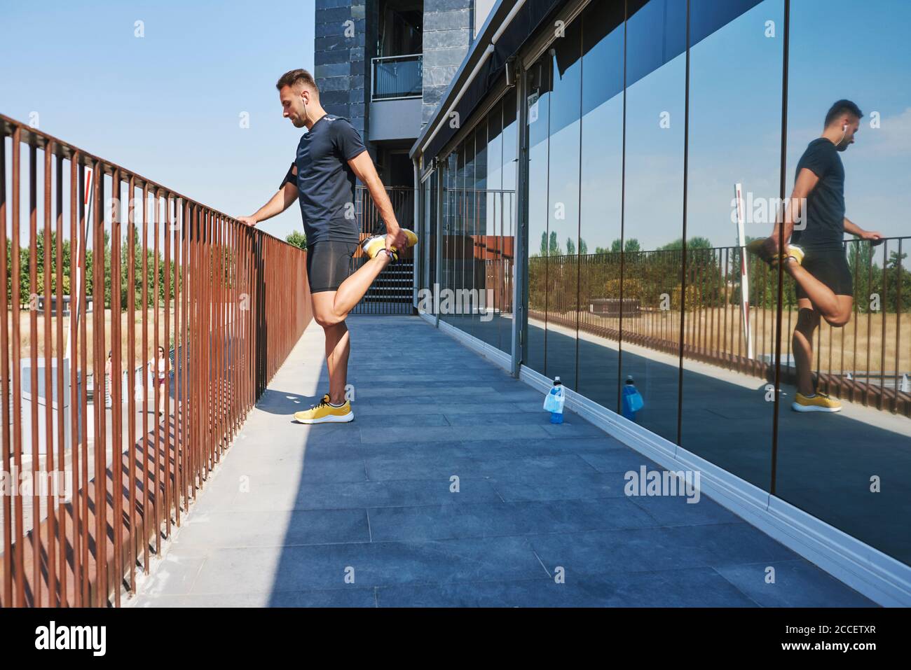 Person stretching leg muscles hi-res stock photography and images - Alamy