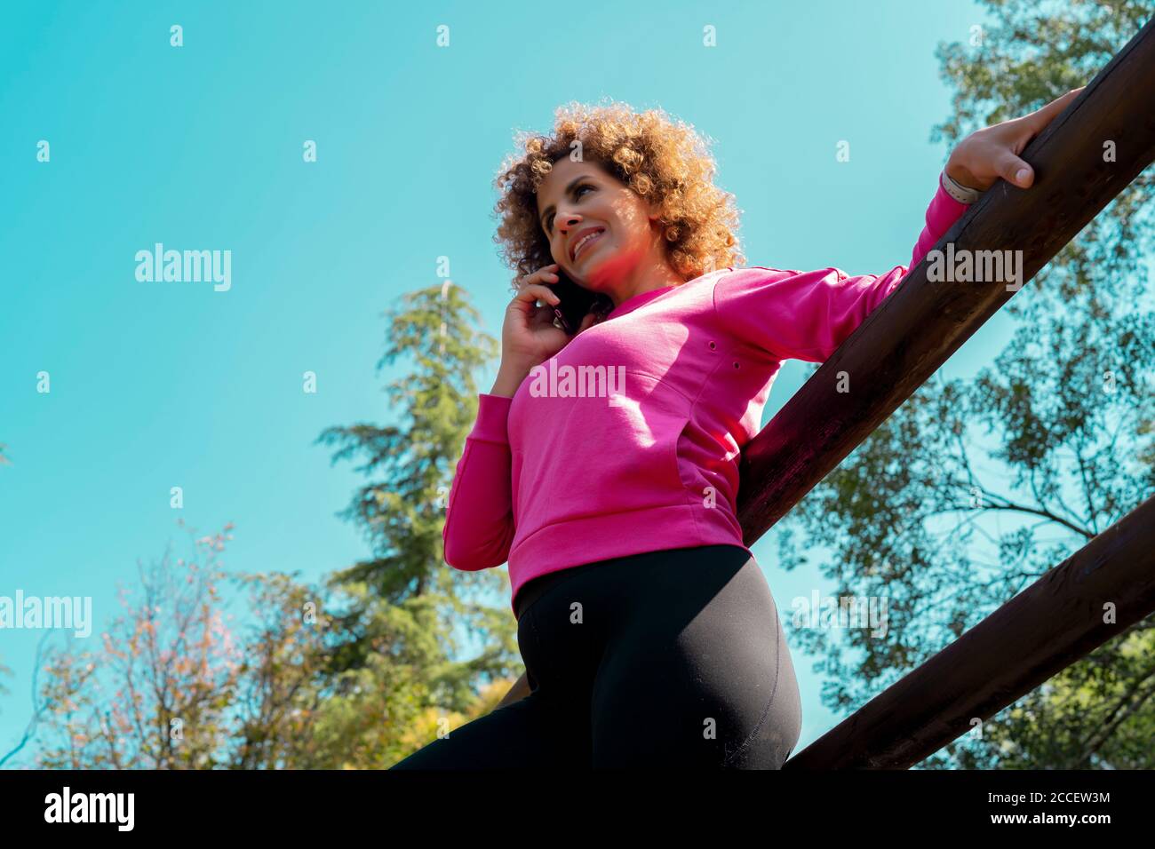woman talking from her smartphone outdoors Stock Photo