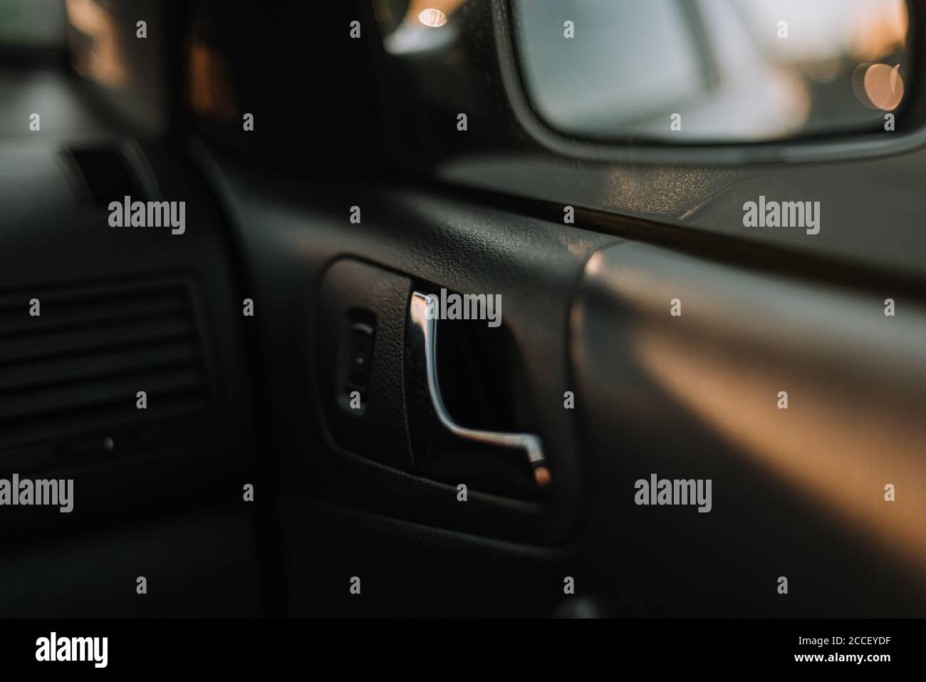 Car door handle, black interrior, metal handle design Stock Photo Alamy