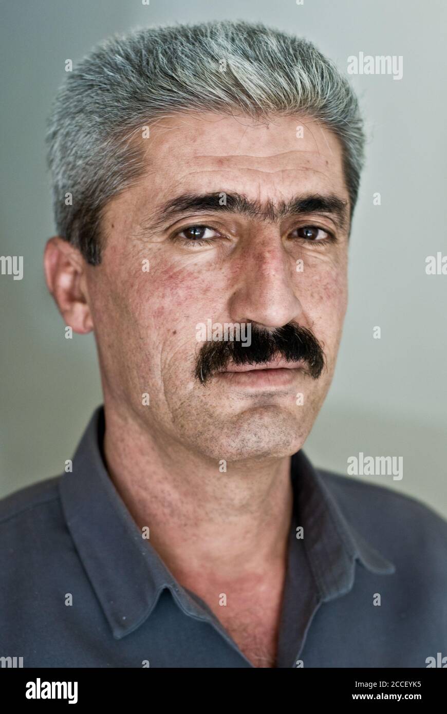 A portrait of a middle aged Kurdish man in traditional garb from the town of Shaqlawa, in the Kurdistan Autonomous Region of Northern Iraq. Stock Photo