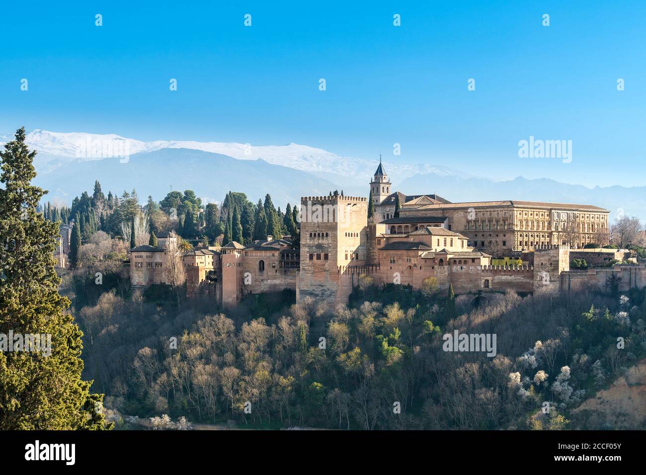 Granada (Spain), view of the Alhambra, in the background Sierra Nevada with snow-capped mountains Stock Photo
