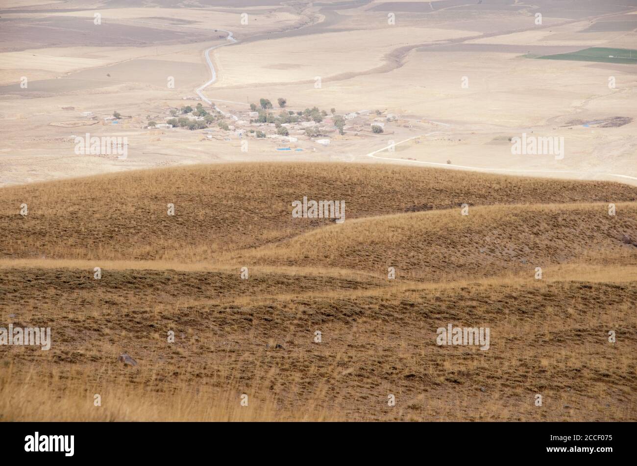 Looking down at a Turkish village from the slopes of Mount Nemrut, near the city of Tatvan, in the eastern Anatolia region, southeastern Turkey. Stock Photo