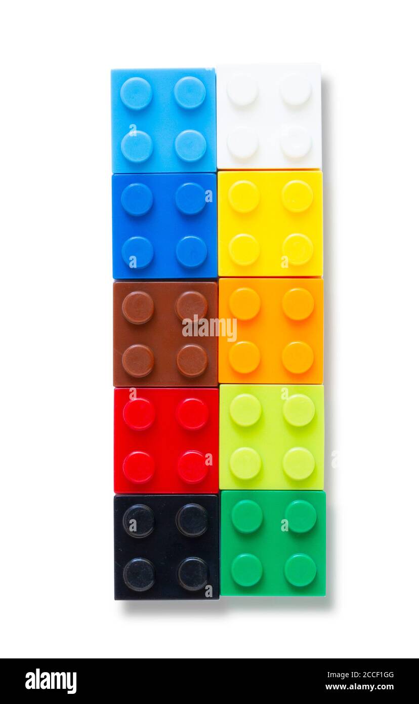 Multi-colored plastic building block on white background Stock Photo