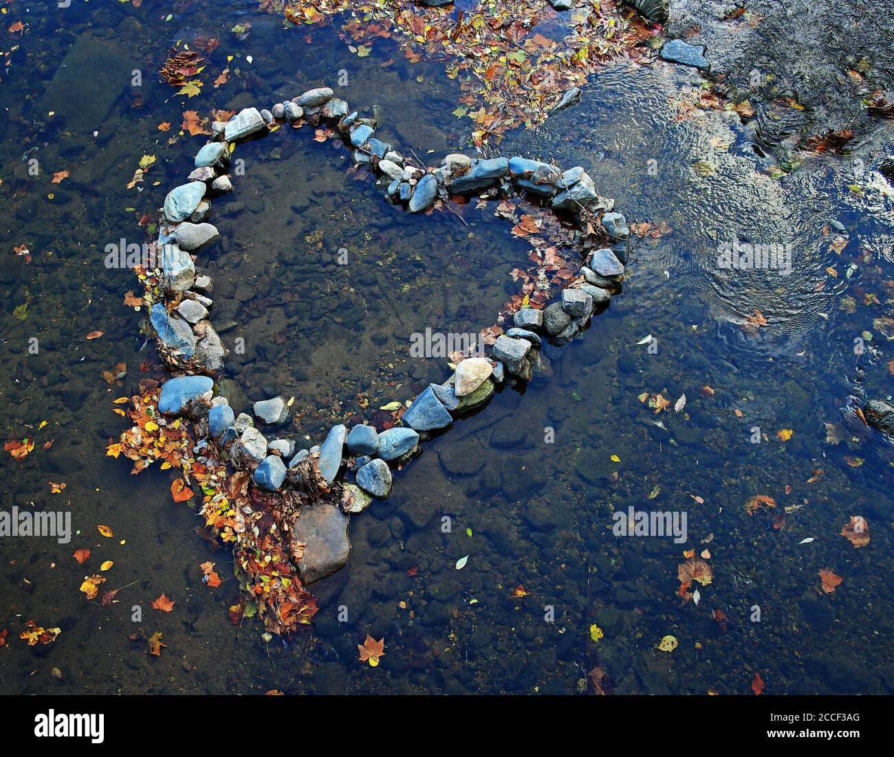 A heart created with river rocks. Stock Photo