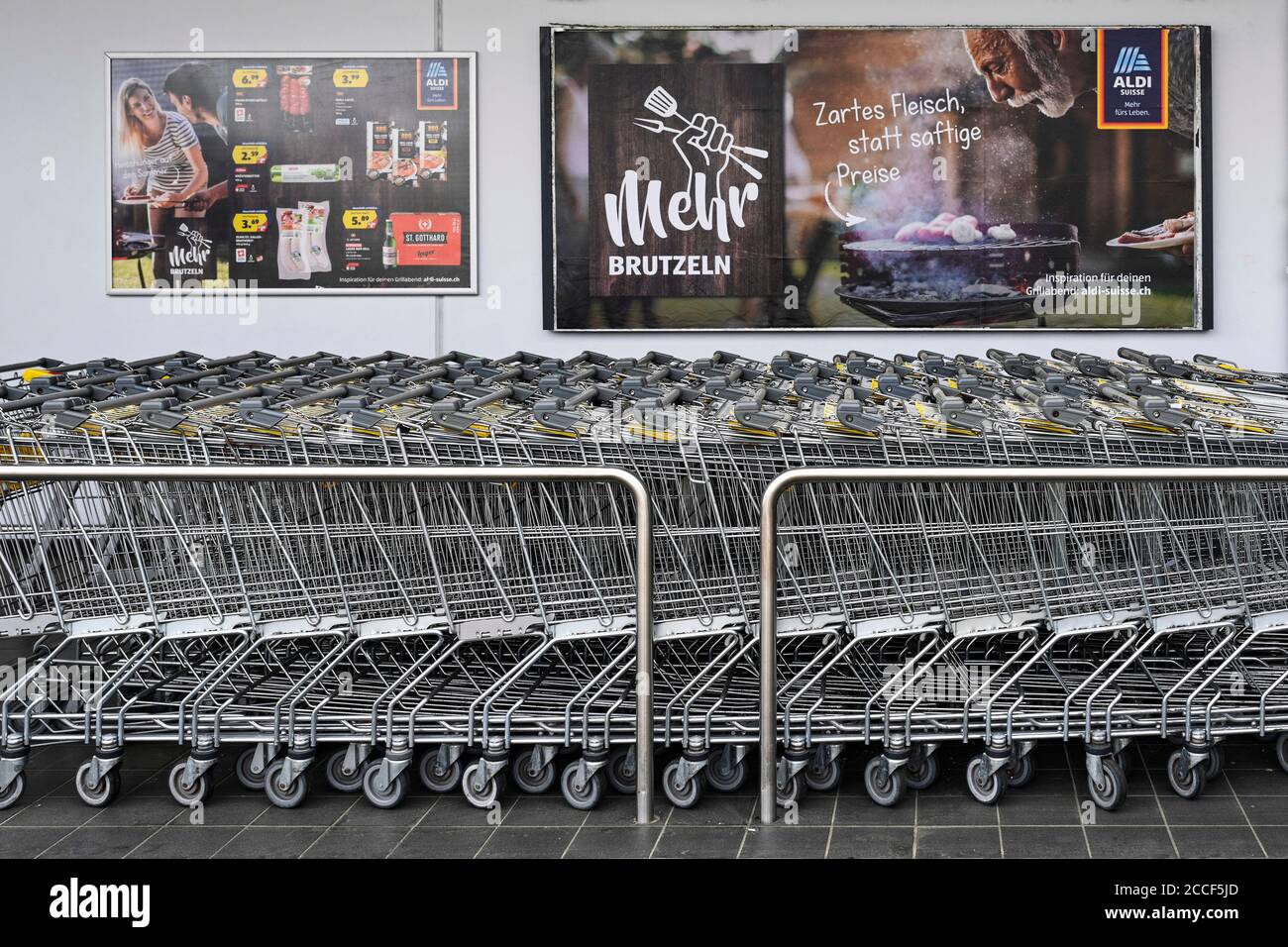 Aldi shopping cart and billboard advertising Stock Photo