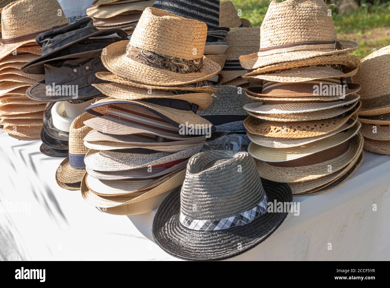 Straw sun hats, stacked, men's hats Stock Photo Alamy