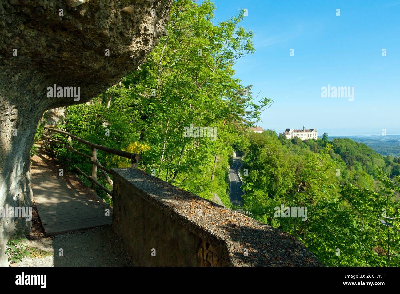 Germany, Baden-Wuerttemberg, Heiligenberg, hiking trail to the Friendship Cave, view to Heiligenberg Castle, natural cave in the so-called Nagelfluh. Stock Photo