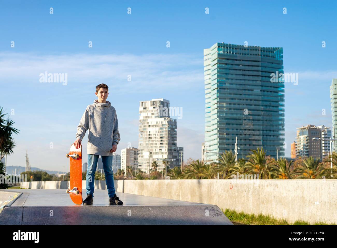 Young skater teen standing on ramp ready to start riding Stock Photo ...