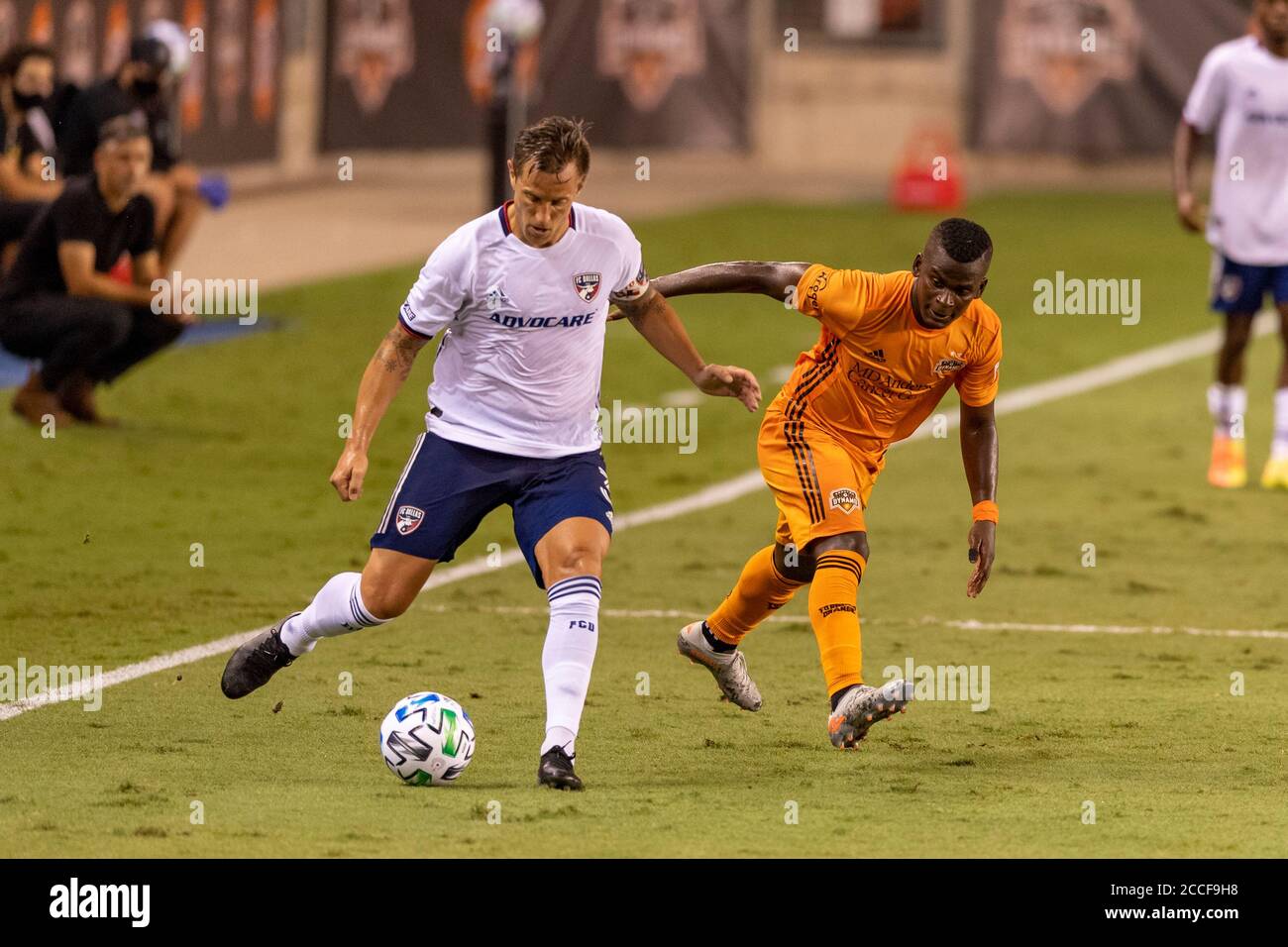 August 21, 2020: Houston Dynamo forward Carlos Darwin Quintero (23) and FC Dallas defender Reto Ziegler (3) battle for the ball during the match in Houston, Texas. Maria Lysaker/CSM. Stock Photo