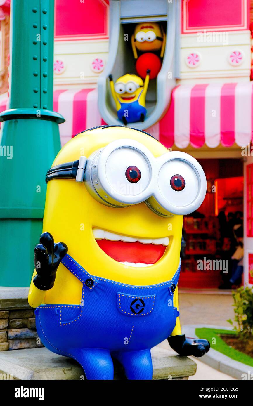 Close up of HAPPY MINION statue in Universal Studios Japan. Minions are  famous character from Despicable Me animation Stock Photo - Alamy
