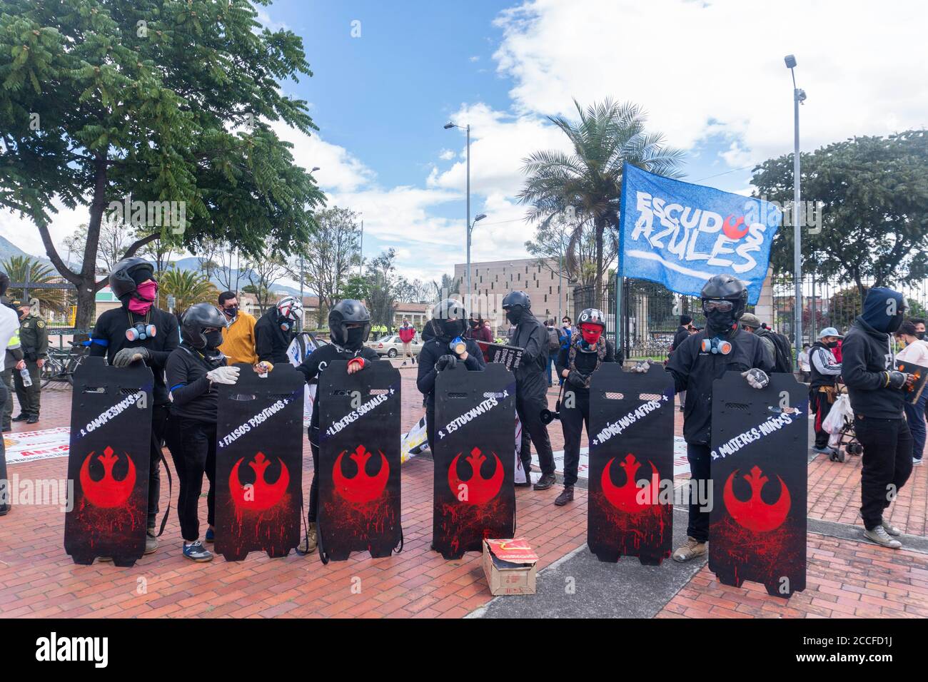 Bogota, Colombia. 21st Aug, 2020. People hold shields at the protest against the recent massacres in NariÃ±o and Cali Credit: Daniel Garzon Herazo/ZUMA Wire/Alamy Live News Stock Photo