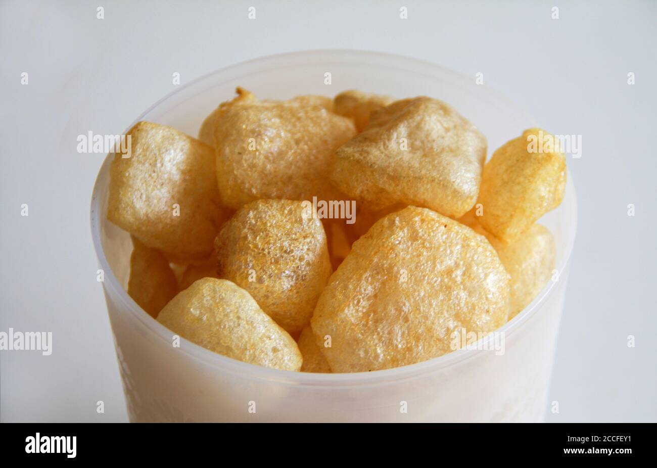 Cattle skin crackers on white background. Stock Photo