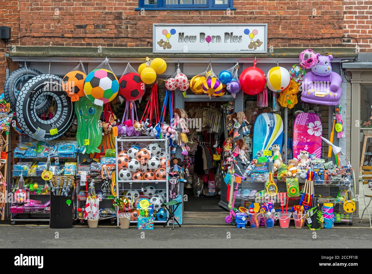A traditional English seaside toy shop of beach toys, buckets, spades and beach balls on sale for the beach in Wells-next-the-Sea in Norfolk, Britain, Stock Photo