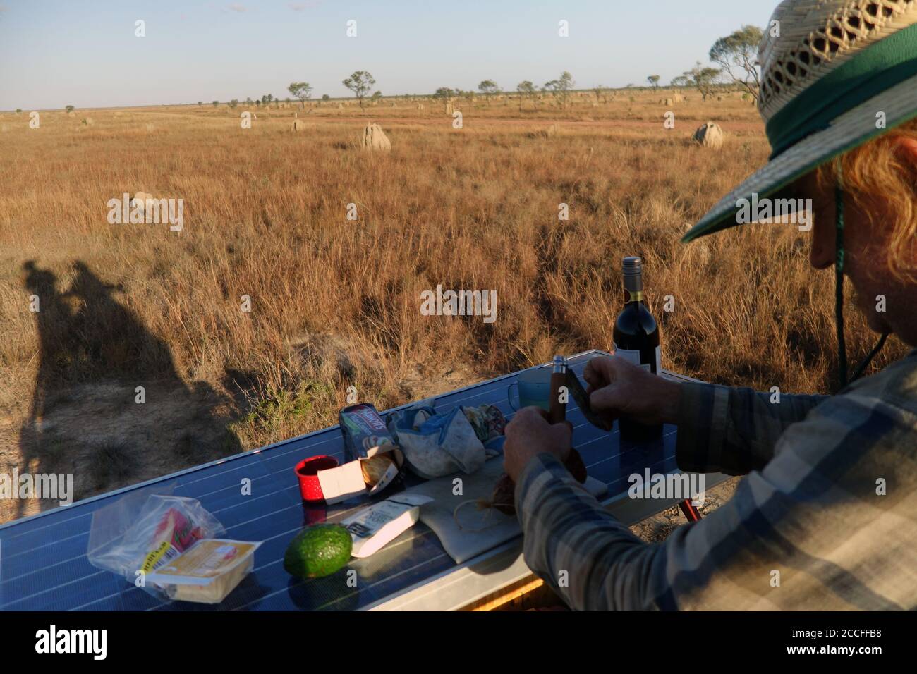 Setting up snacks on rooftop of 4WD, Nifold Plains, Lakefield National Park, Cape York Peninsula, Queensland, Australia. No MR or PR Stock Photo