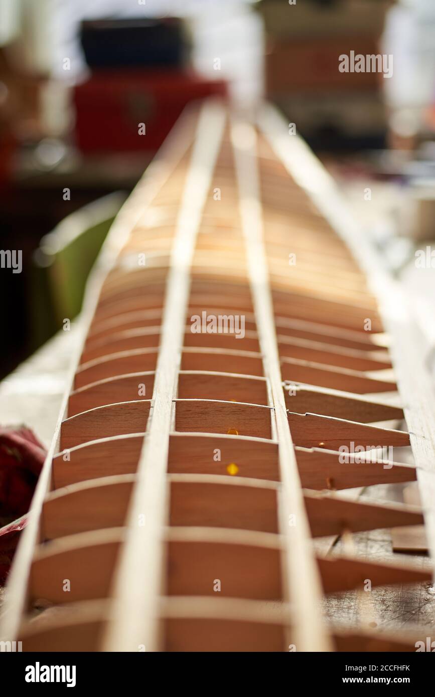 The wooden wing of a radiocontrolled aircraft in the the