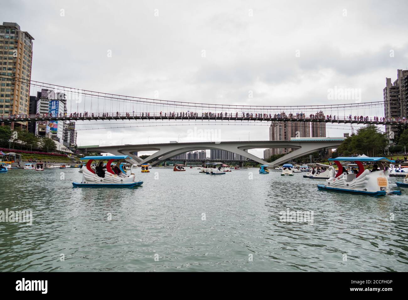 NEW TAIPEI CITY, TAIWAN - JANUARY 31, 2017 - Unidentified people enjoying pedal boats at Bitan Scenic Area Stock Photo