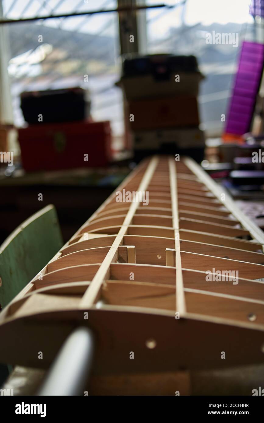 The wooden wing of a radiocontrolled aircraft in the the