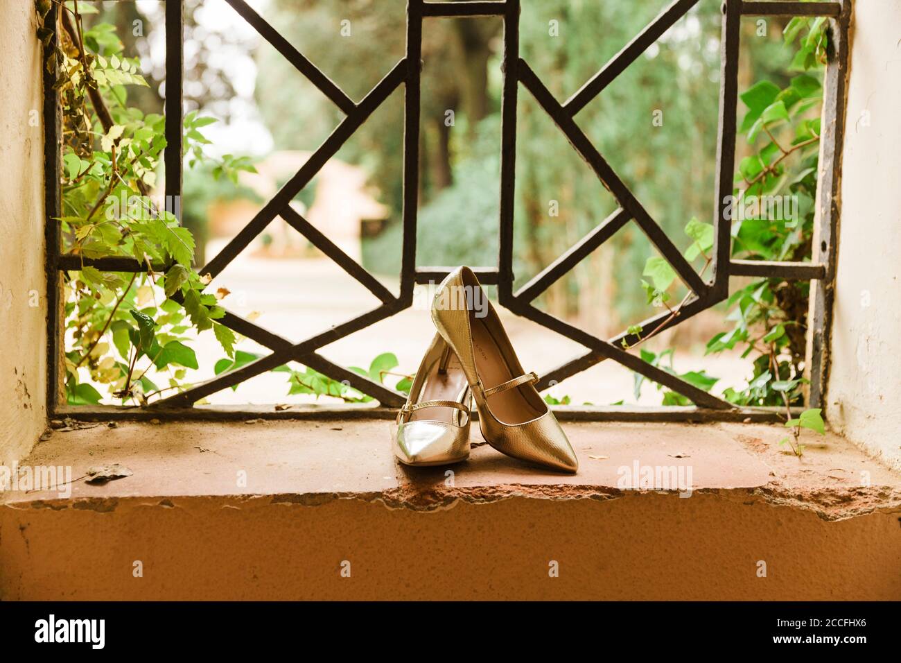 Wedding, shoes, windows, gold, in the middle Stock Photo